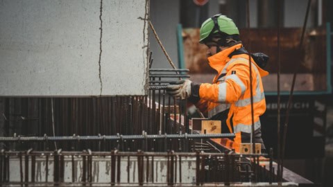Rebar reinforcement steel installation at construction site for building foundation.